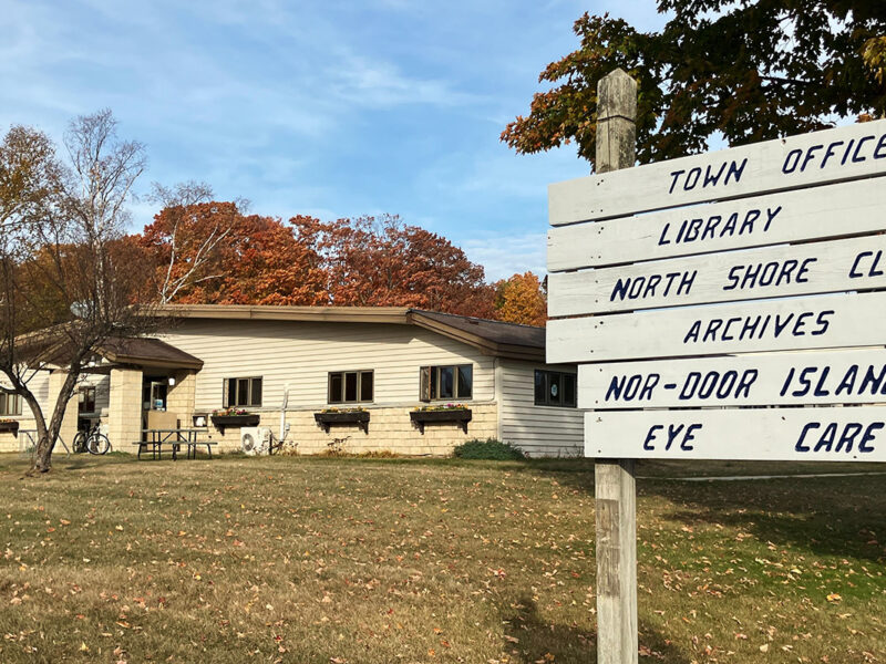 Image of the sign in front of the Washington Island Community Center, home of the town office.