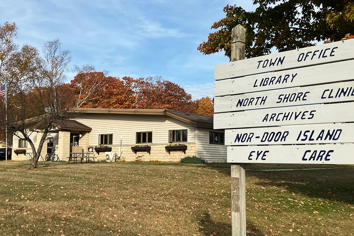 Image of the sign in front of the Washington Island Community Center, home of the town office.